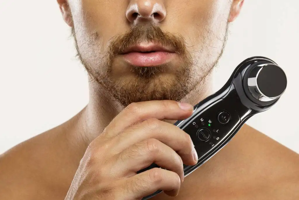 Young man with unkempt beard before a shaving routine