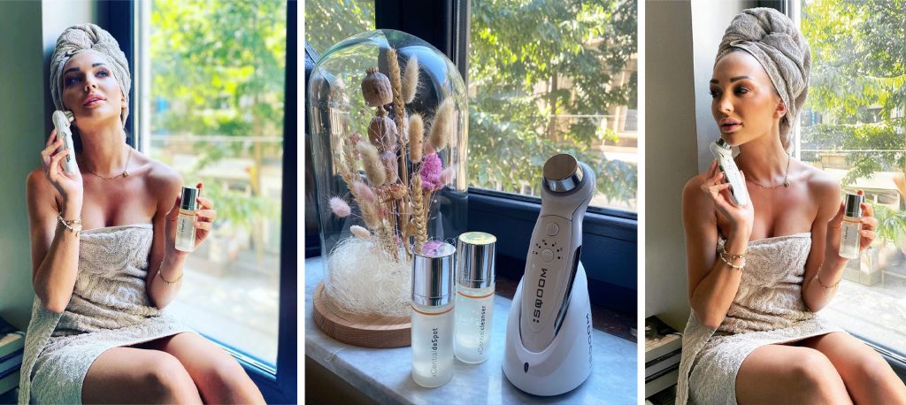 Chayenne Van Aarle, The Miss Belgium 2022, in a robe, sitting by a window holding SQOOM anti-aging serum and skincare device, one of the official sponsors of Miss Belgium Gala